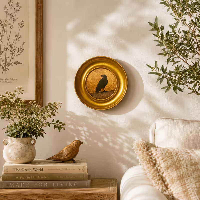 A Crow Standing on a Round Metal Photo Frame Wall Art