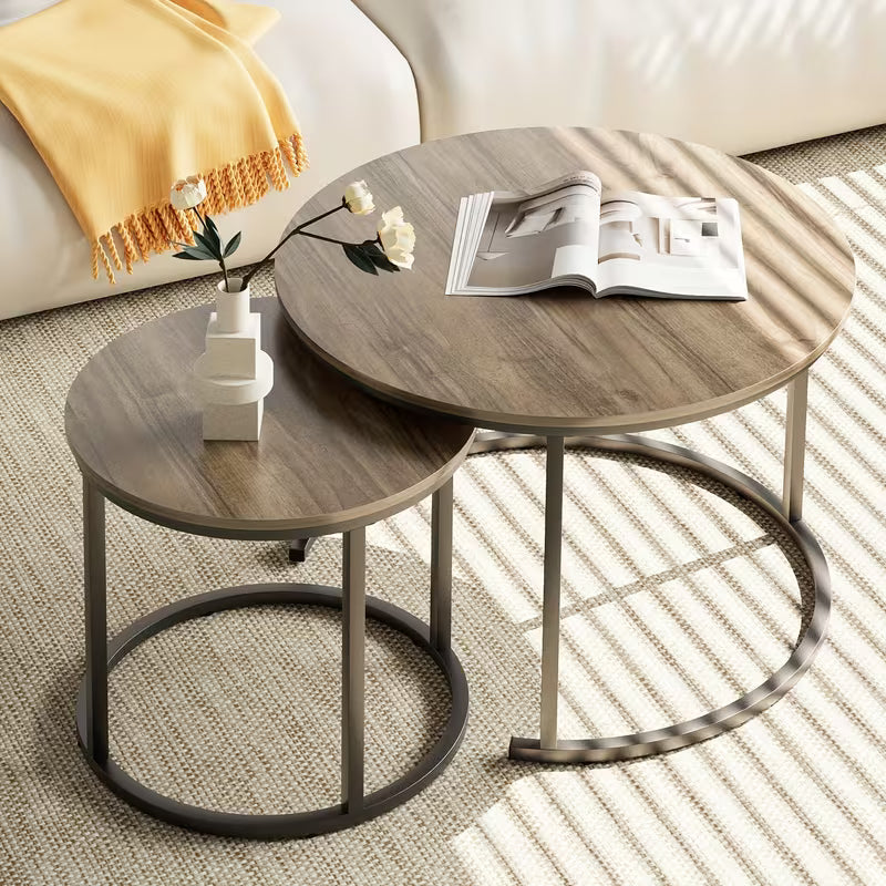 Set of Two Circular Nesting Tables Featuring a White Faux Marble Top And a Golden Frame