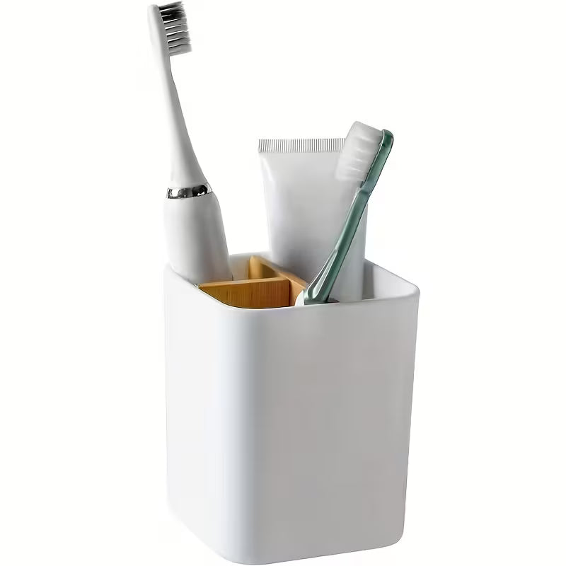 A Bathroom Storage Solution Featuring Three Sections Designed for Toothbrushes And Toothpaste